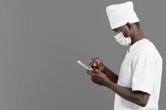 professional-young-doctor-standing-sideways-copy-space