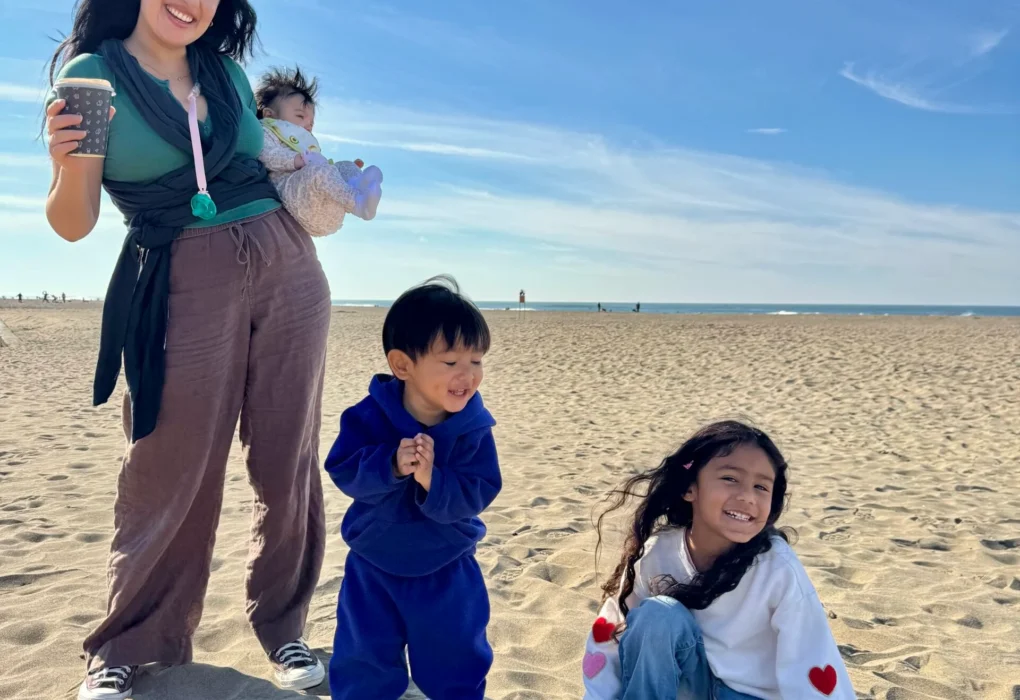 Jannelle and kids on the beach